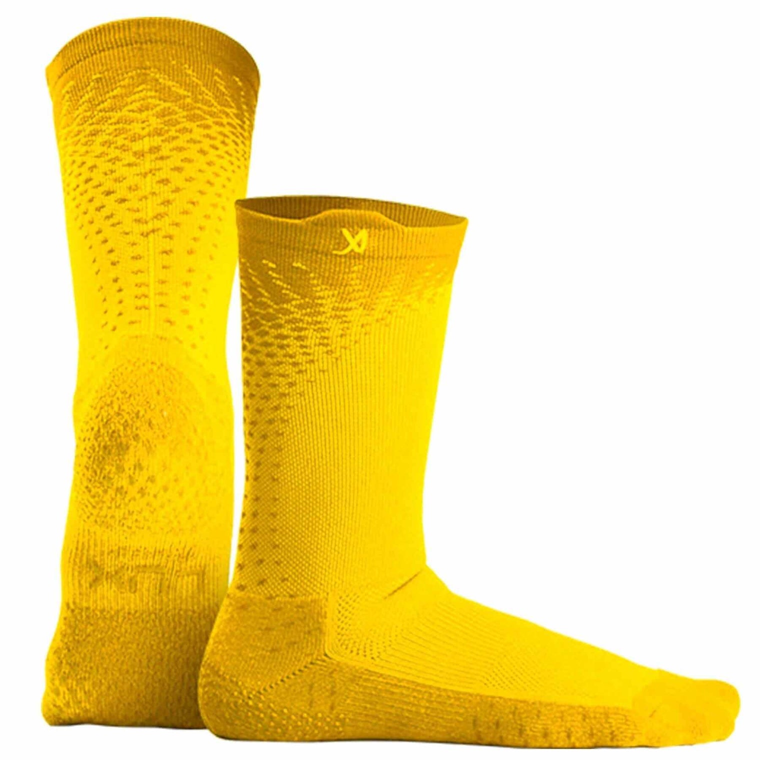 Football player showcasing agility while wearing Performance Grip Cleat Socks