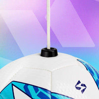 Blue football kick trainer with string attached, designed for all skill levels.